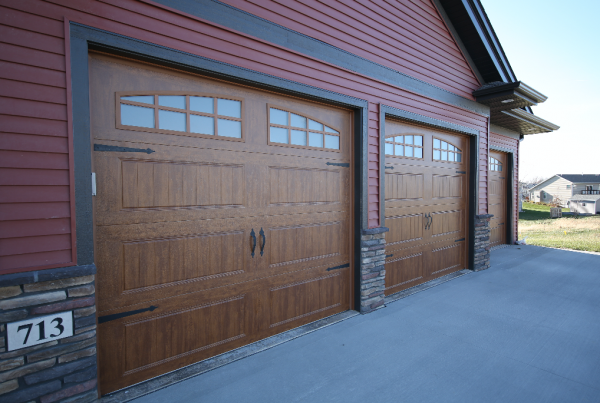Wood Garage Doors Rustic Exterior Stebral Construction Home Builder Iowa City, Coralville, Solon, North Liberty